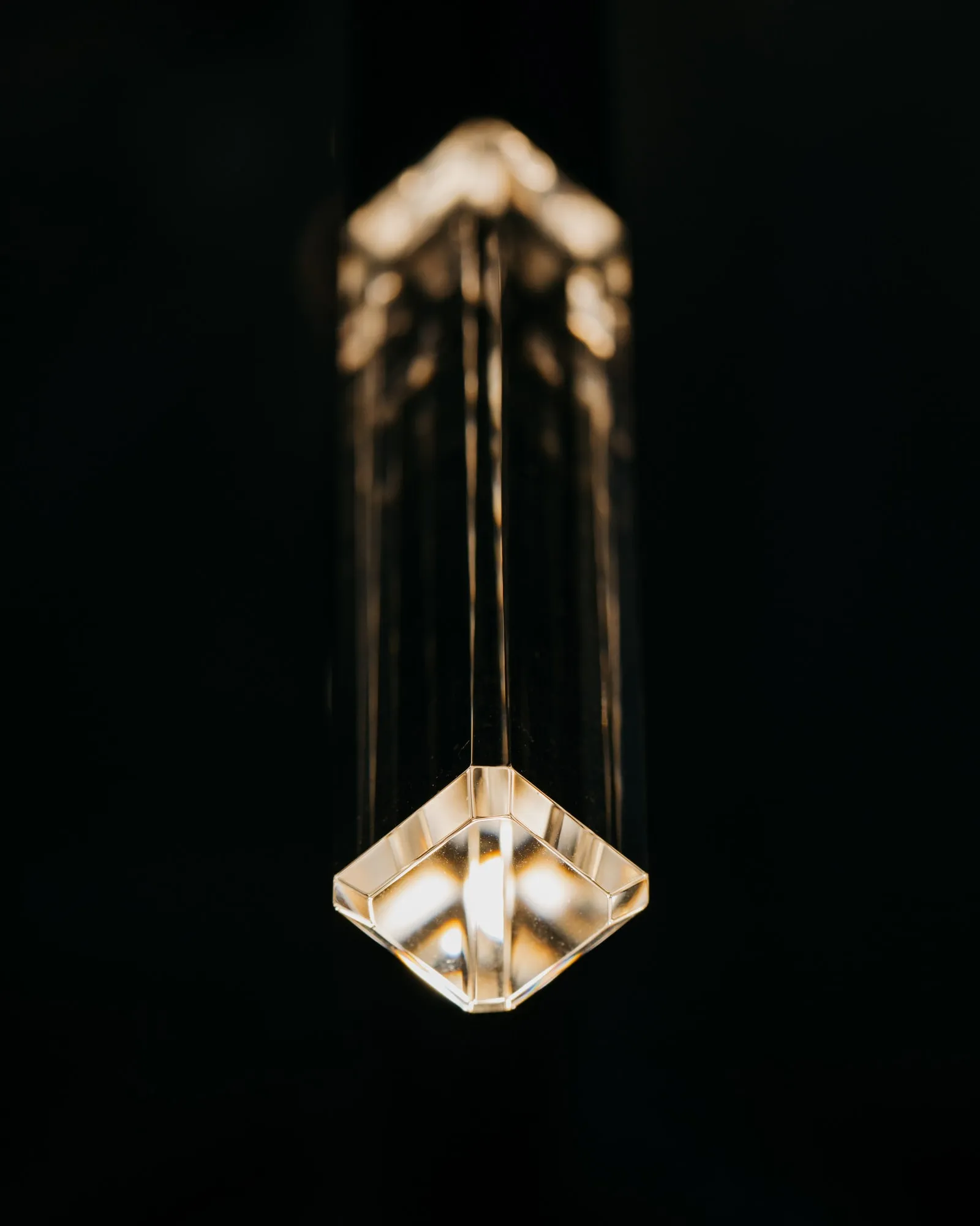 A JAX crystal glowing at the end of an arm, close up