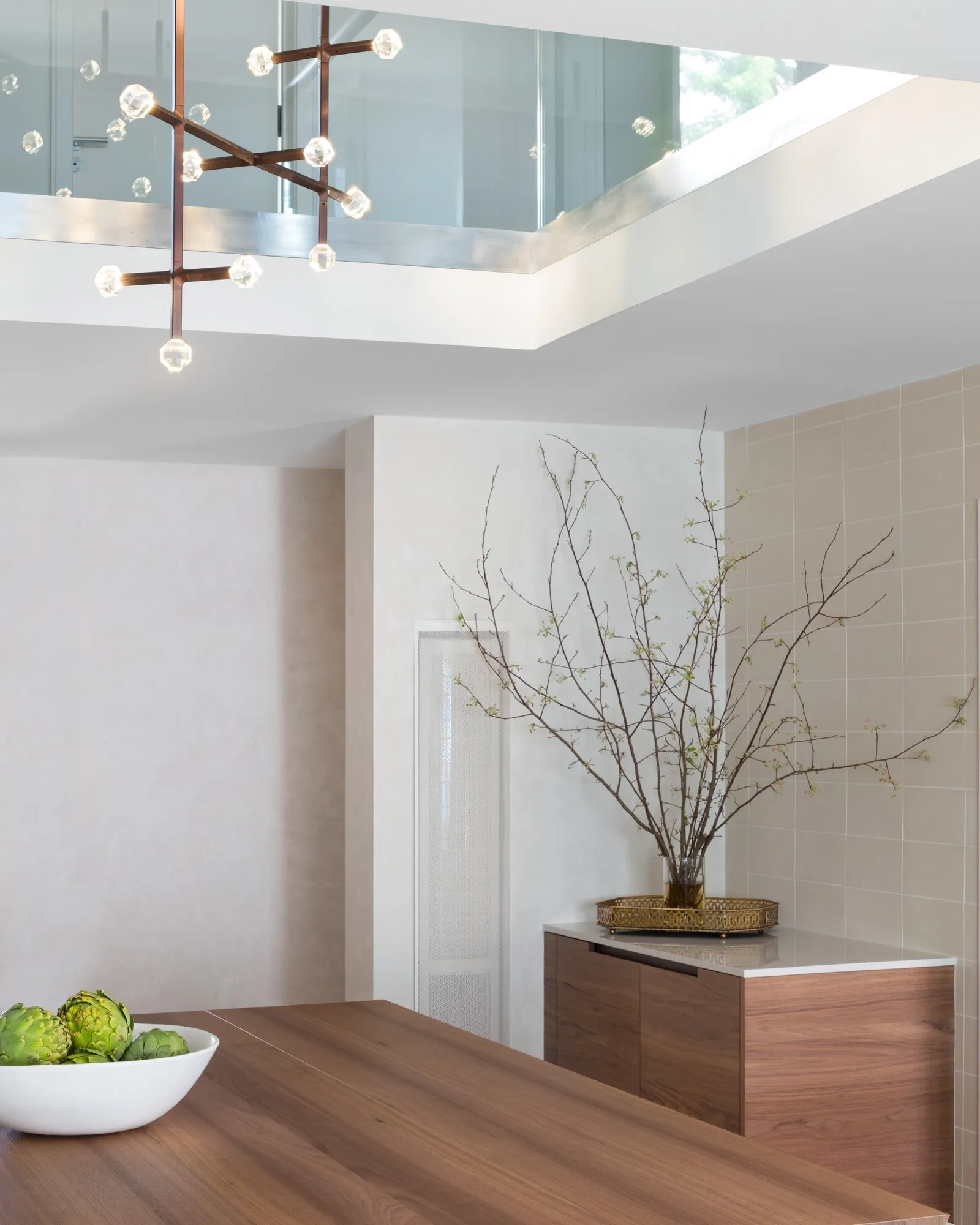 JOULLE pendants under a skylight above a kitchen counter