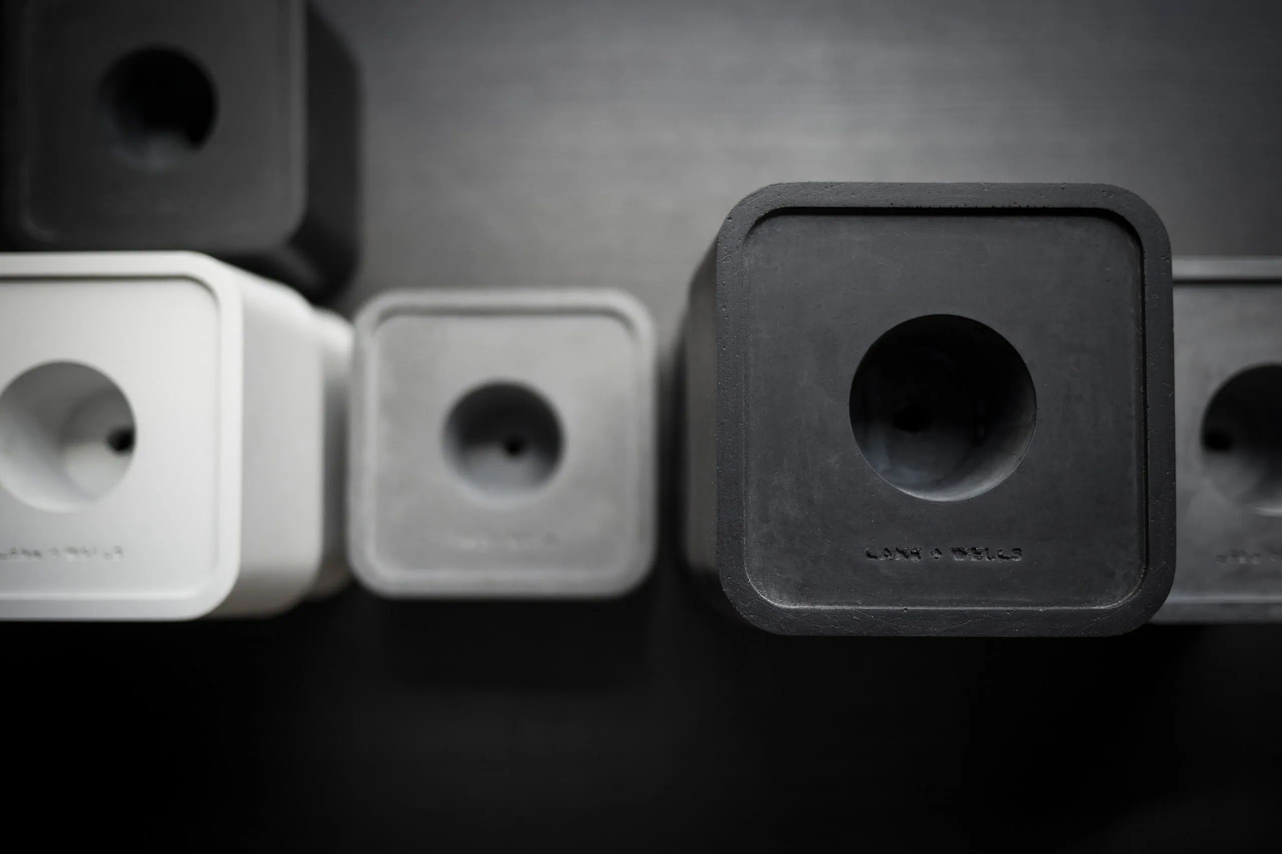 Faaro concrete bases in white, grey and black