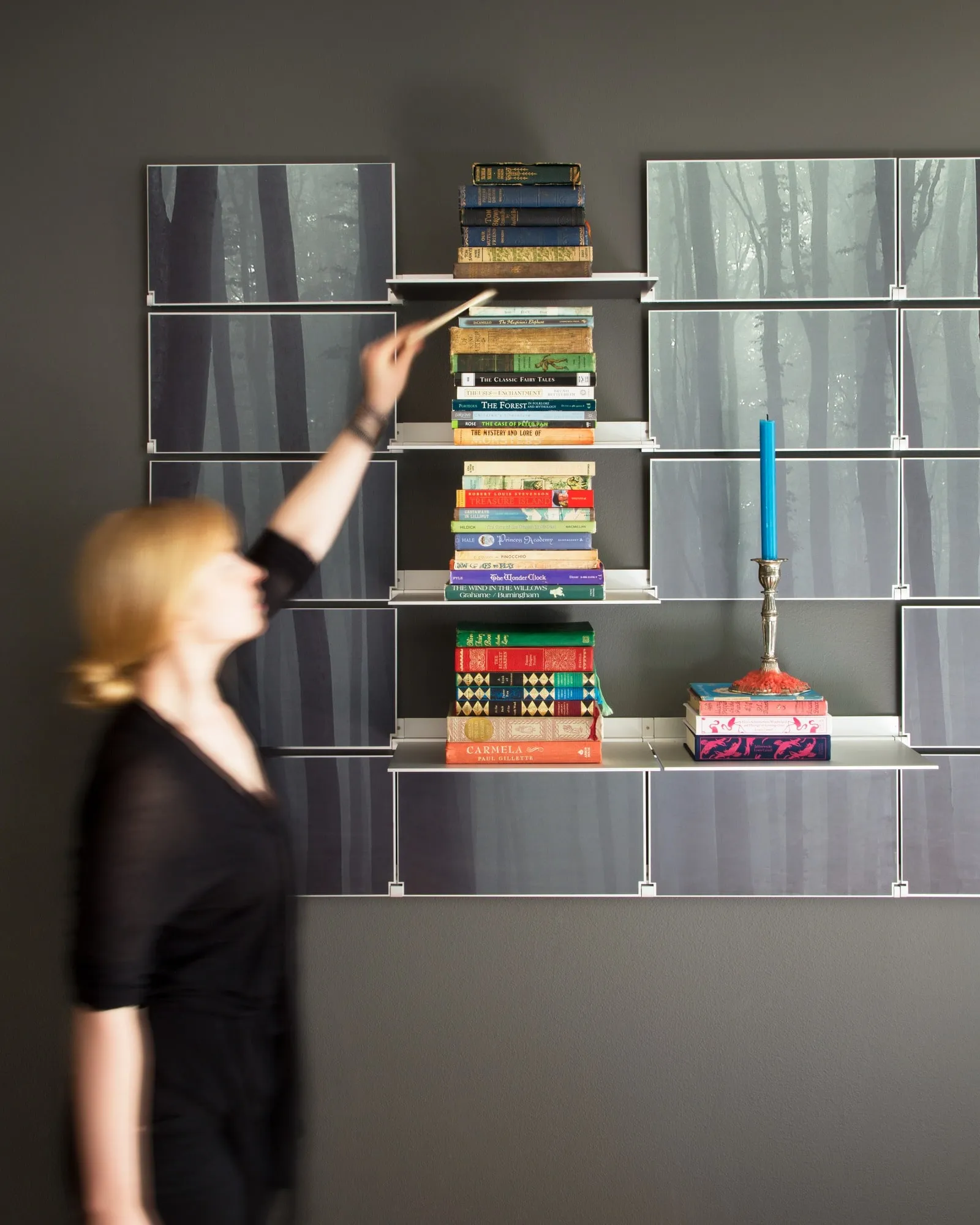 Riveli Art Shelves printed with a forest, stacked with books