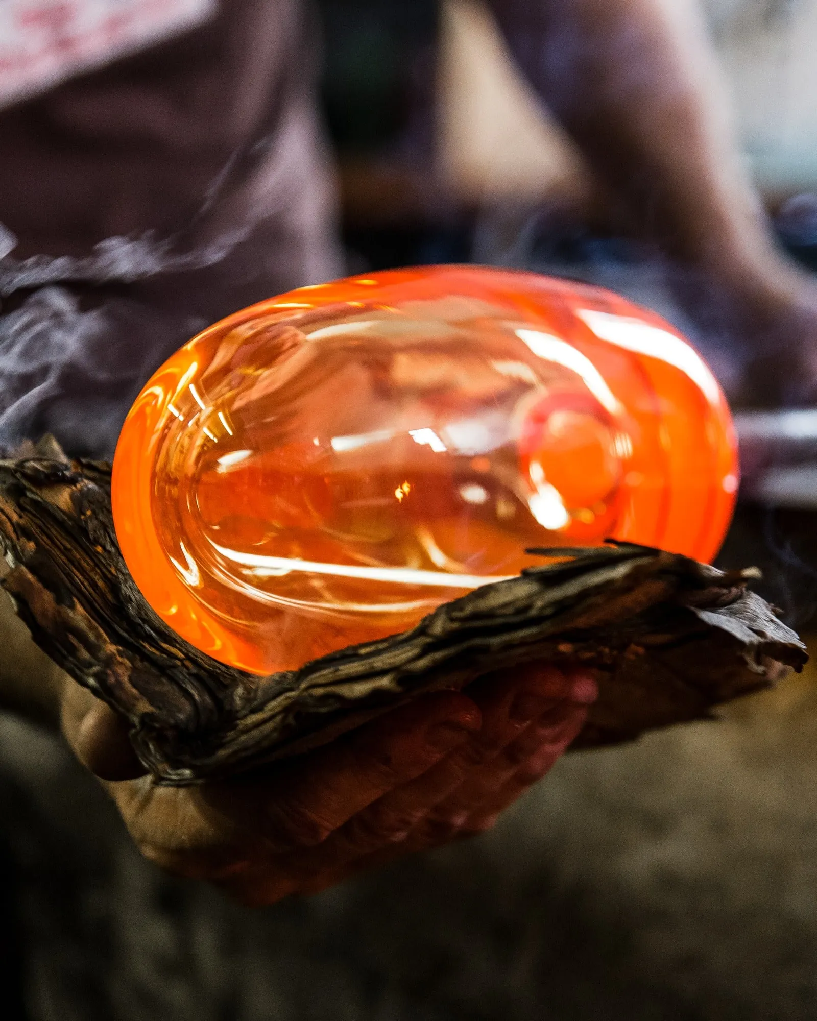 Hot glass for a Faaro, held in a wet wooden block