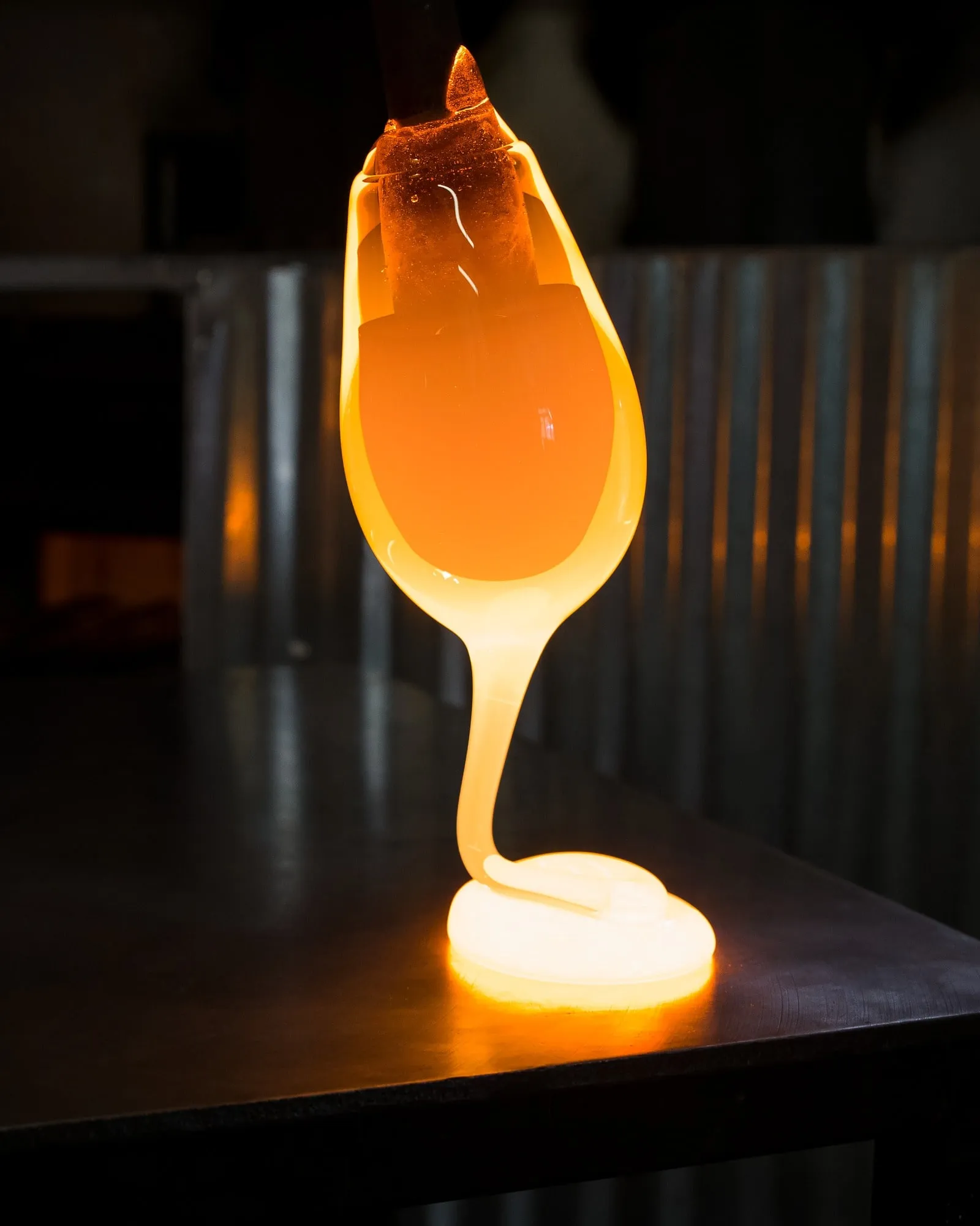 Molten glass falling onto a steel table
