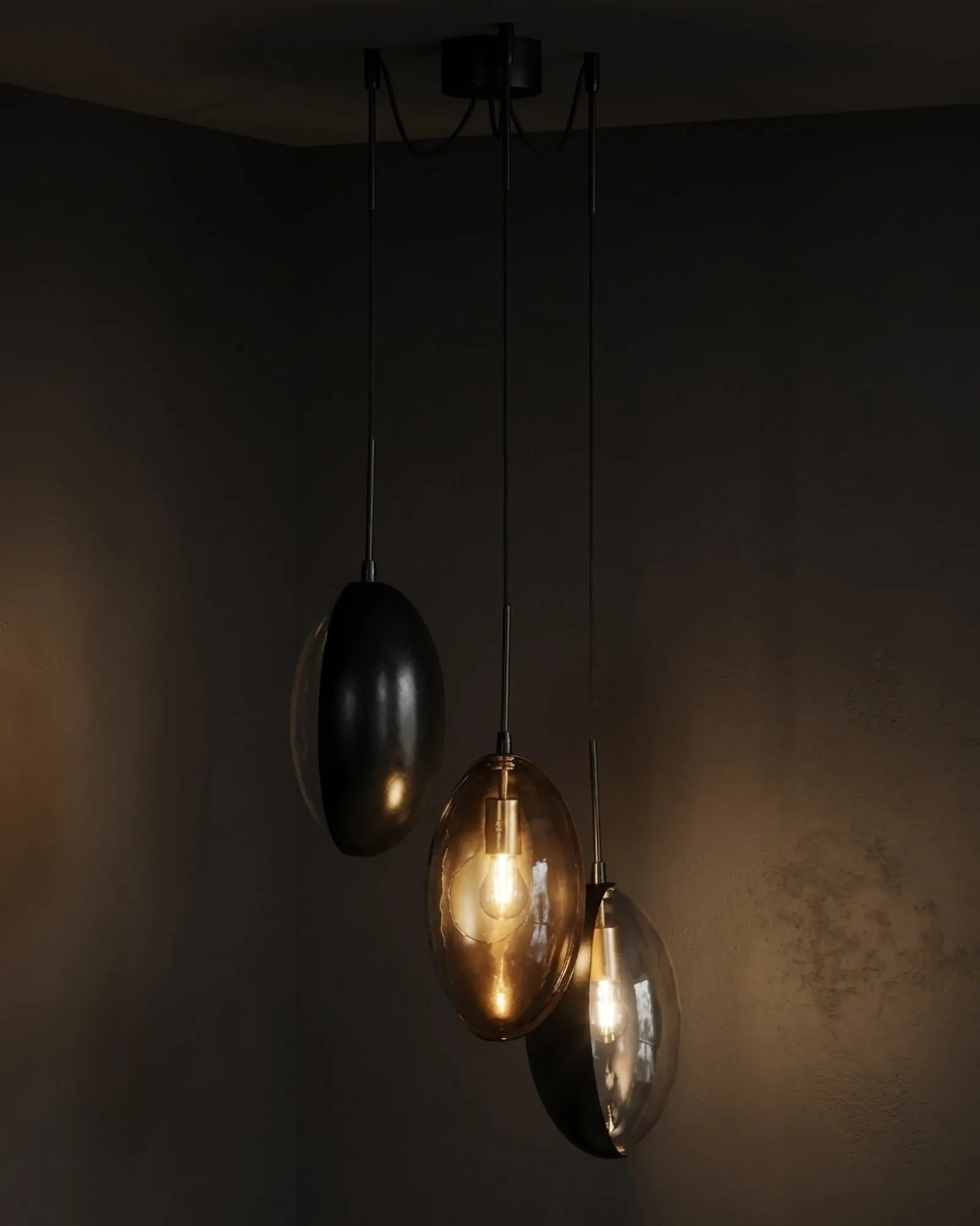 Three Oona pendants hung from one canopy, lit