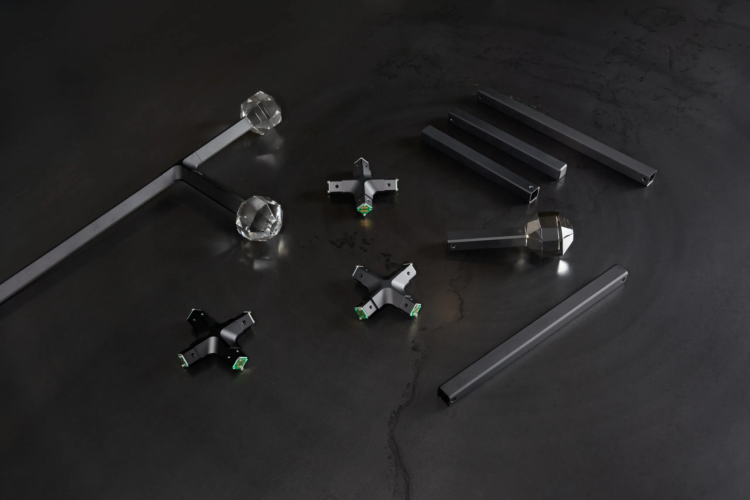 JOULLE parts laid out: arms, connectors and crystal stones