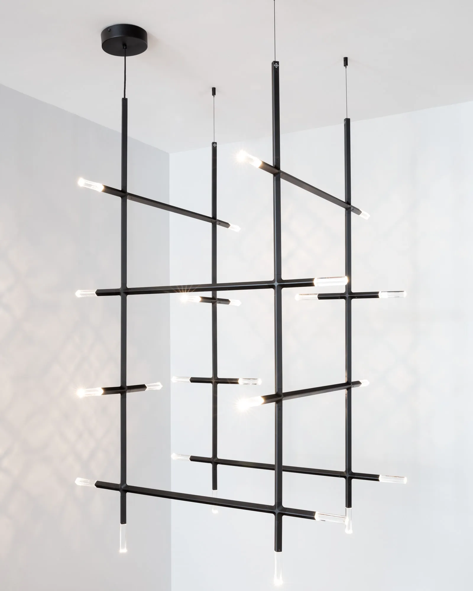 A JAX chandelier of several stems and crossing arms in black