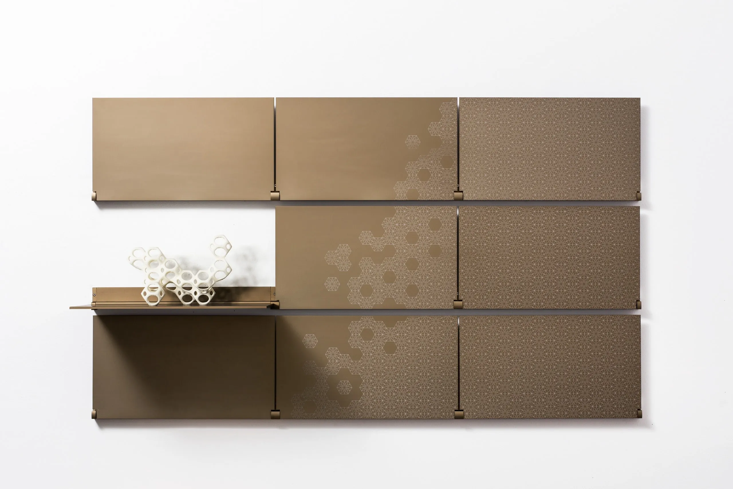Riveli Luxe Shelves in Aged Bronze, all shelves up, then one shelf down with a sculpture on hover