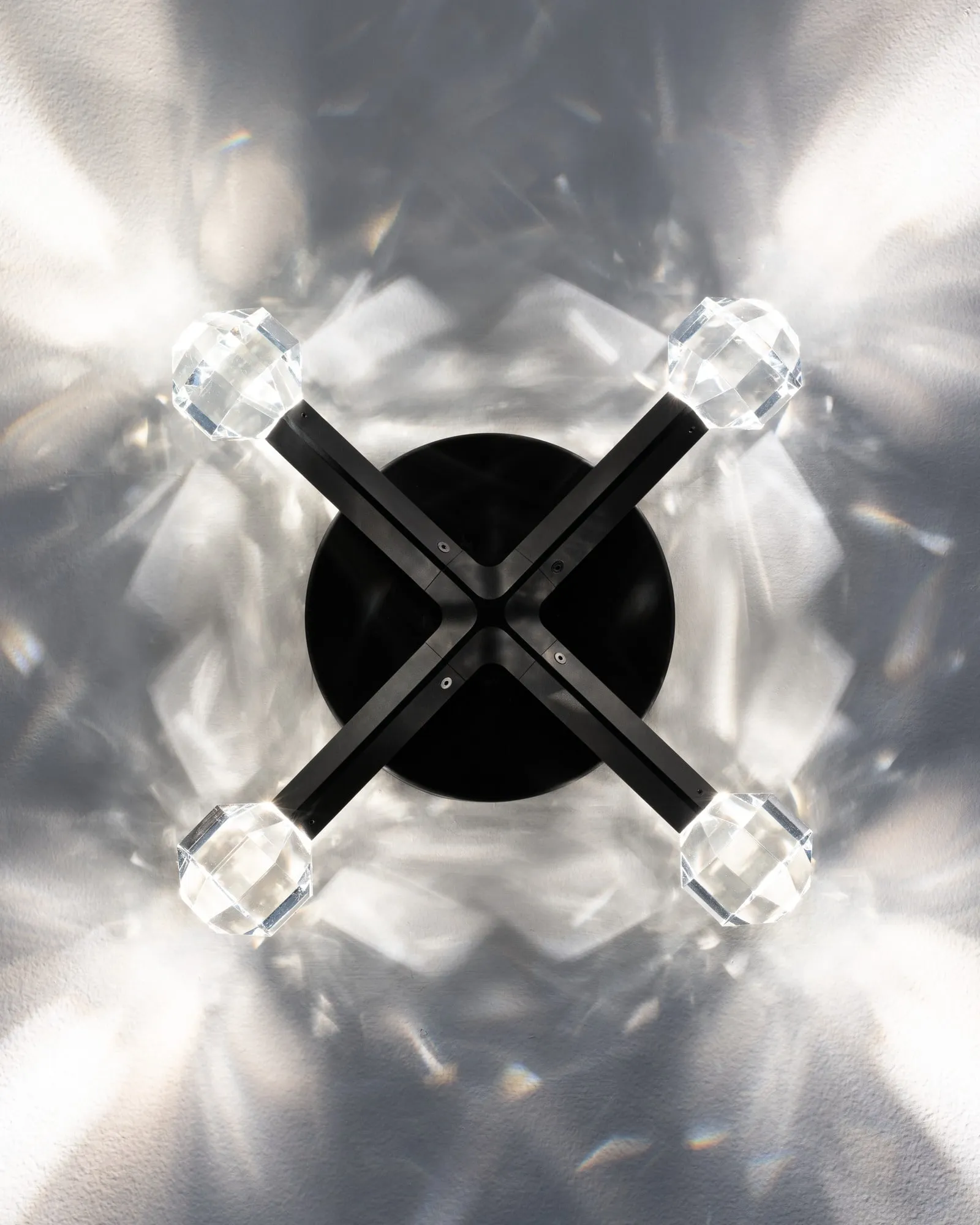 A JOULLE fitting seen from below, its crystal stones scattering light