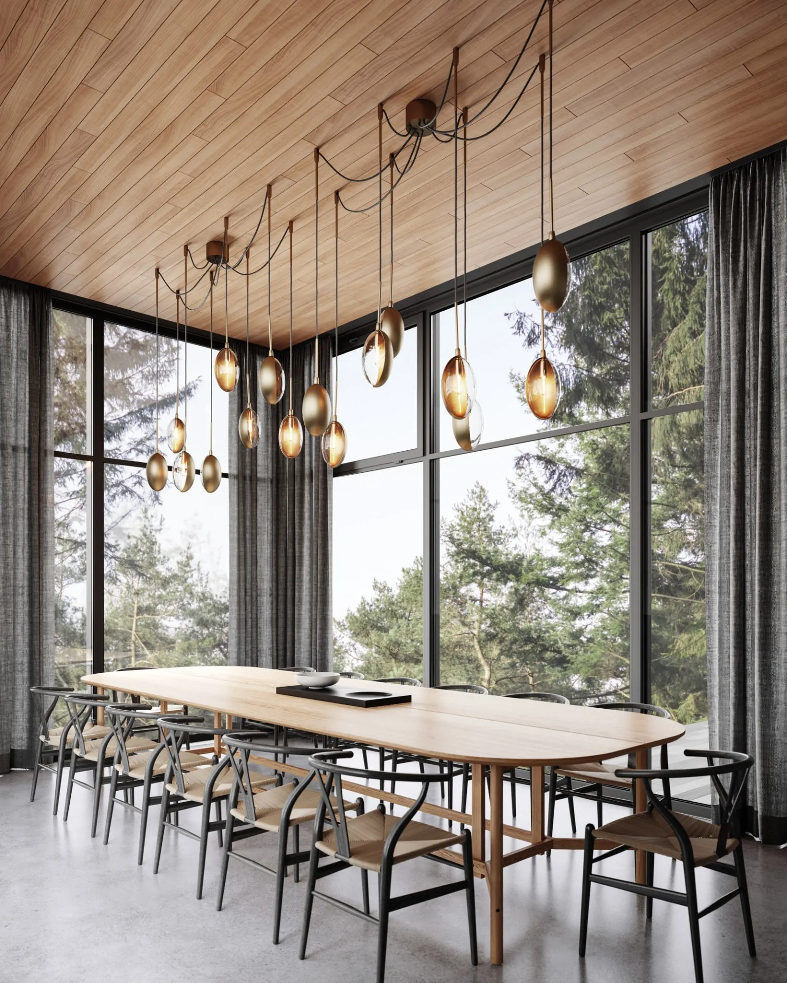 Oona pendants over a long dining table in a glass-walled room with a timber ceiling